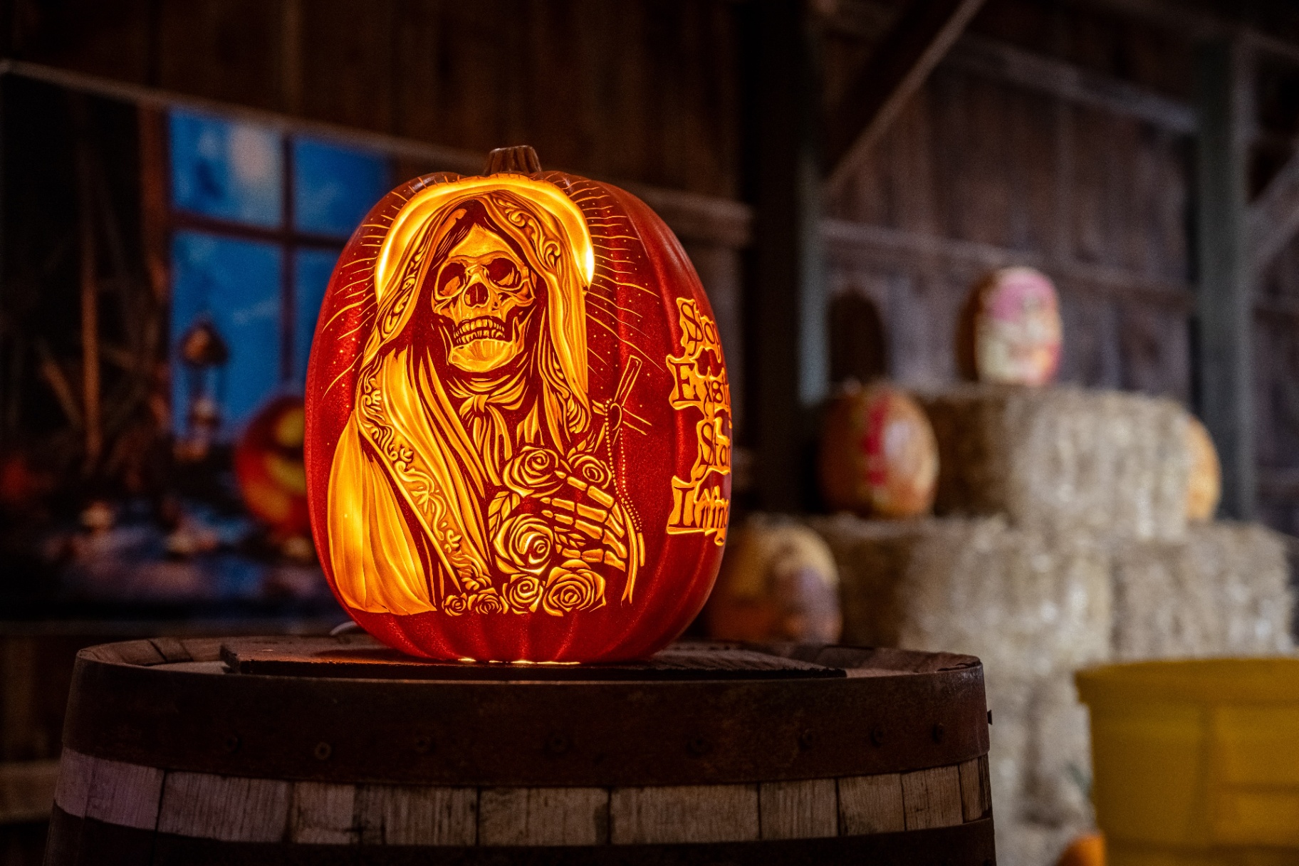 A panoramic night view of the Pumpkins After Dark grounds lit by glowing pumpkins